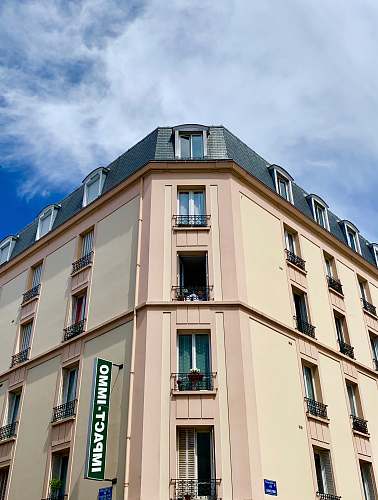 home decor white and green concrete building during daytime corner